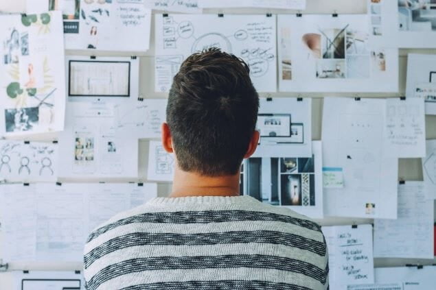 Person looking at a white board with plans and activities